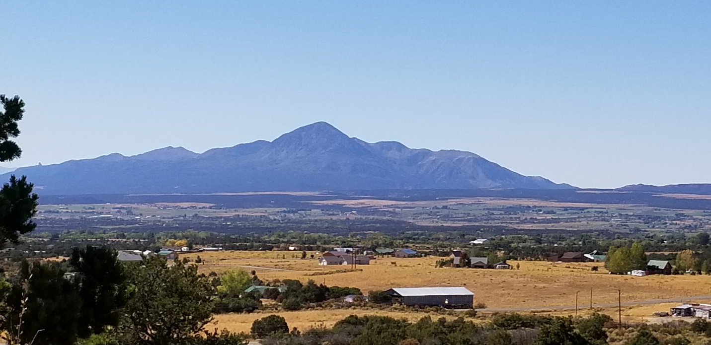 A large mountain in the background

Description automatically generated