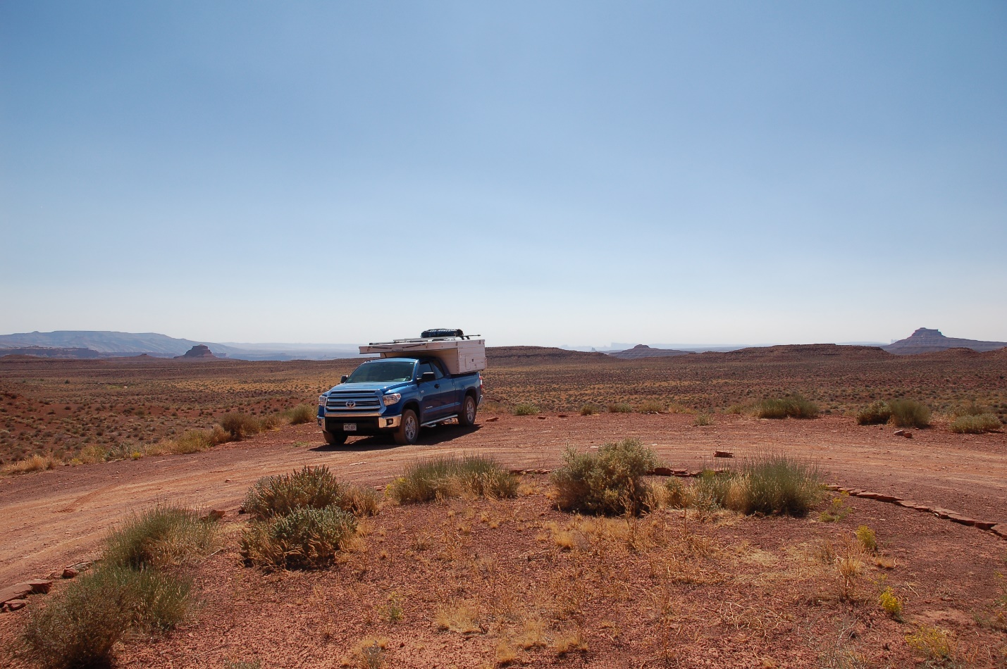 A truck on a dirt field

Description automatically generated